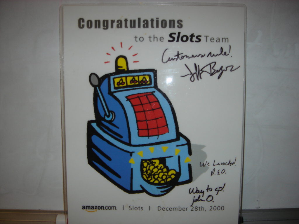 Amazon.com Slots launch poster (signed by Jeff Bezos) - Ruben Ortega